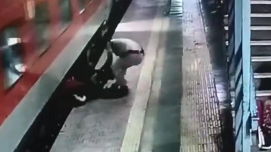 Heroic Rescue: Mumbai RPF Officer Saves Man Trapped Under Moving Train